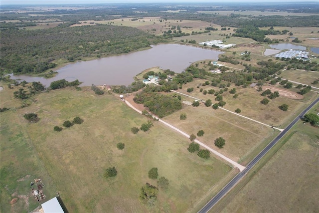 birds eye view of property featuring a water view and a rural view