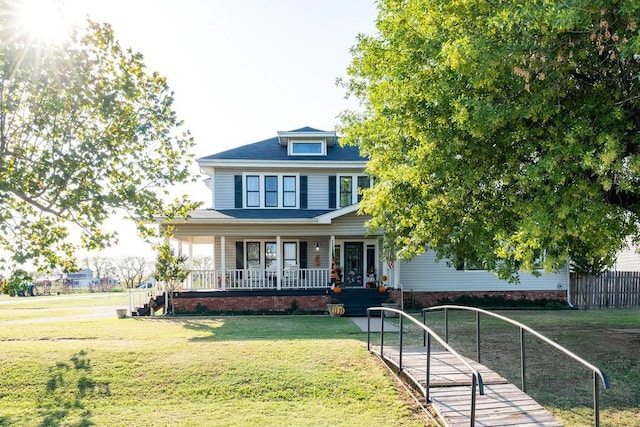 view of front of home with a front lawn and covered porch