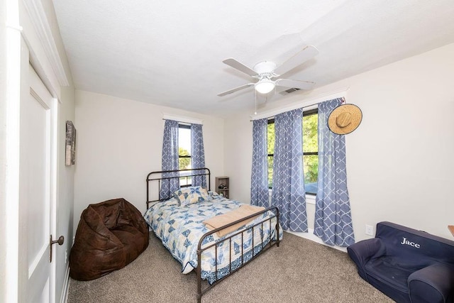 carpeted bedroom featuring ceiling fan