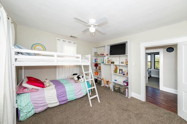 bedroom with ceiling fan and wood-type flooring