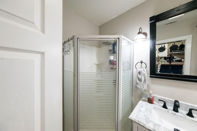 bathroom featuring vanity and walk in shower