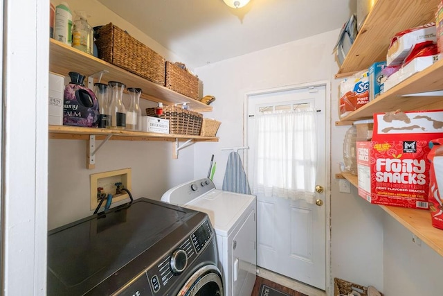 clothes washing area featuring washing machine and dryer