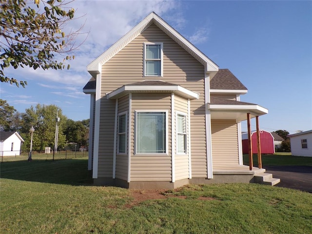 exterior space with a yard and a storage shed