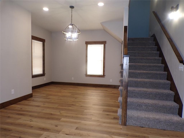 stairway featuring hardwood / wood-style flooring