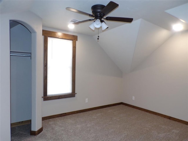 additional living space with carpet, ceiling fan, and lofted ceiling