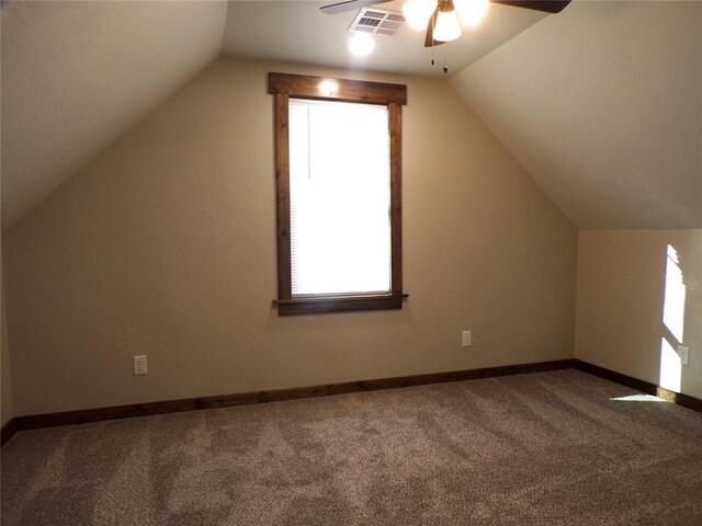 bonus room with carpet, ceiling fan, and lofted ceiling