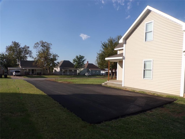 view of property exterior featuring a yard