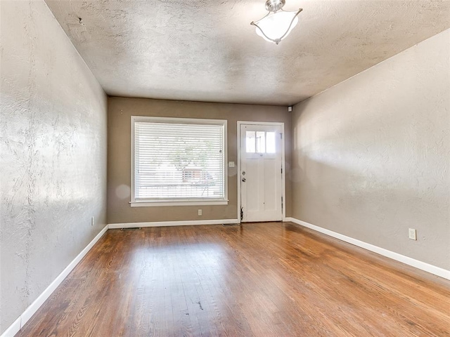 foyer entrance with wood-type flooring