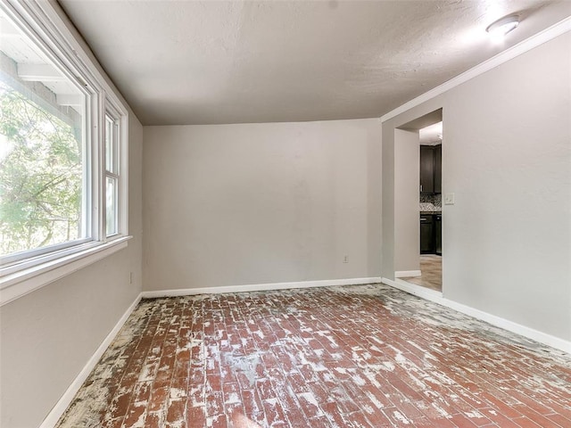 spare room with crown molding