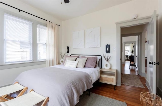 bedroom featuring dark hardwood / wood-style floors and ceiling fan