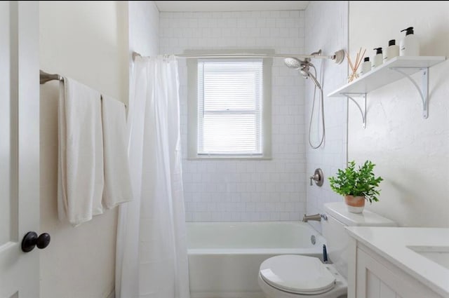 full bathroom with vanity, shower / bath combo, and toilet