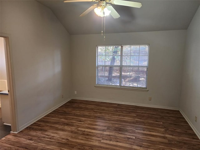 spare room with ceiling fan, dark hardwood / wood-style flooring, and lofted ceiling