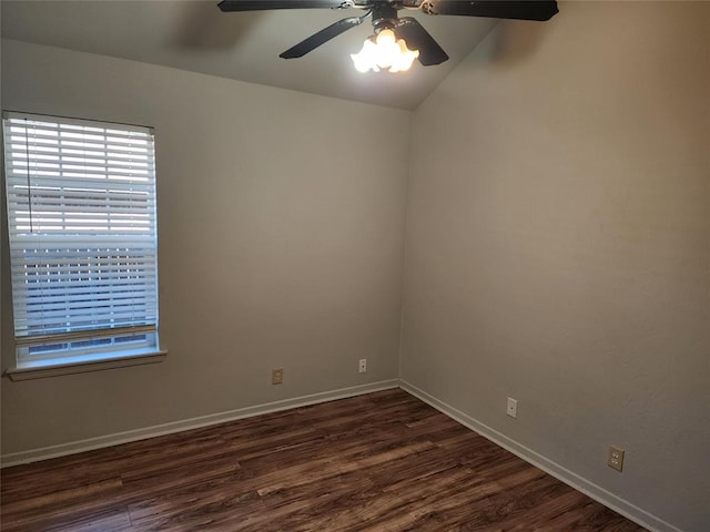 unfurnished room featuring ceiling fan, lofted ceiling, and dark wood-type flooring