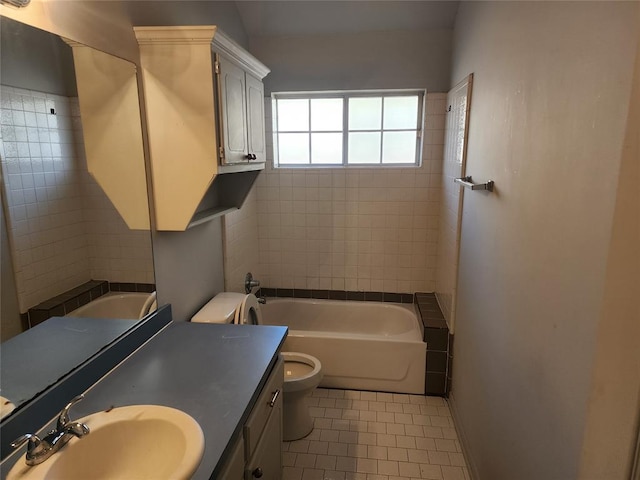 full bathroom featuring tile patterned floors, vanity, tiled shower / bath combo, and toilet