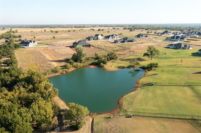 aerial view with a water view and a rural view