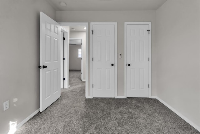 unfurnished bedroom with carpet floors