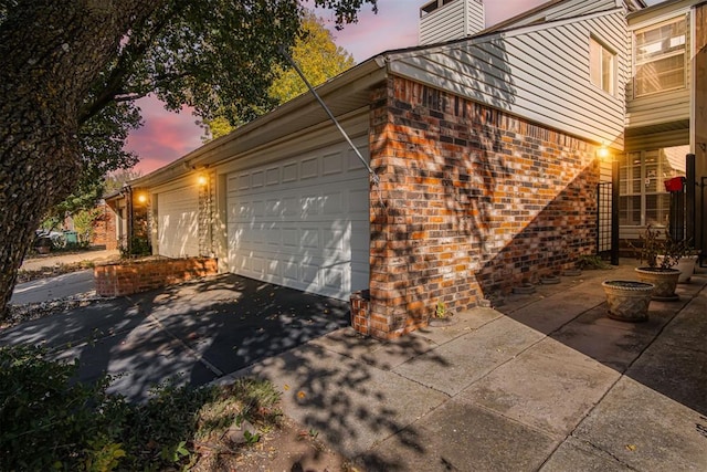 view of property exterior at dusk