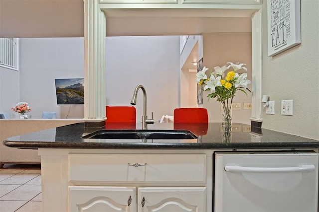 interior space featuring sink and tile patterned flooring