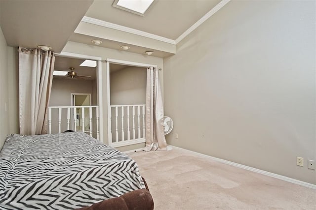 carpeted bedroom with ornamental molding