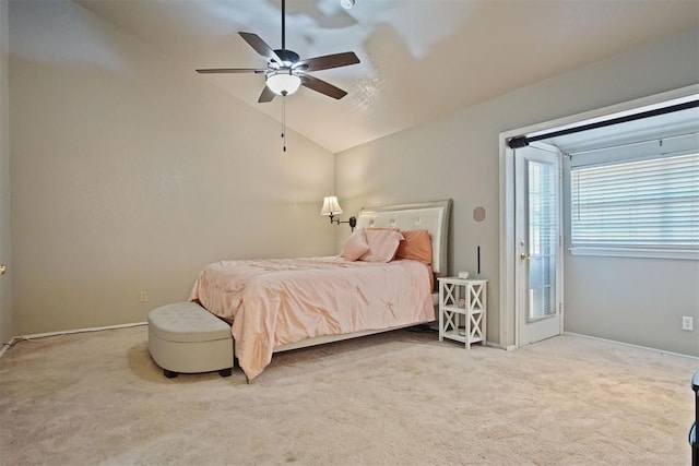 carpeted bedroom featuring vaulted ceiling and ceiling fan