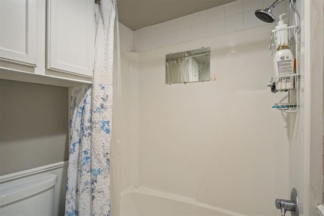 bathroom featuring toilet and shower / bathtub combination with curtain