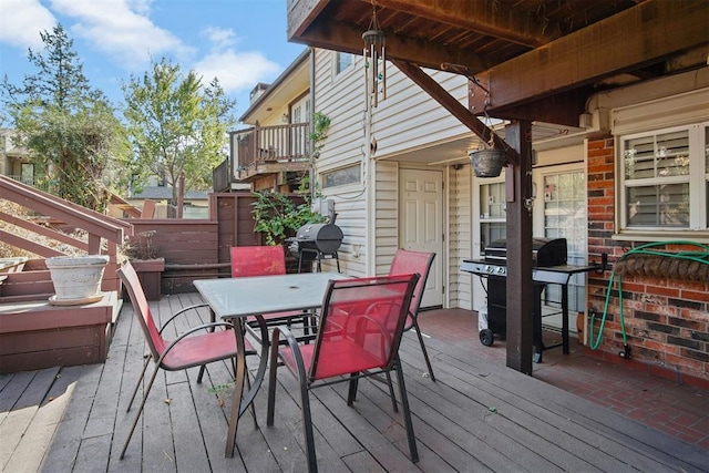 wooden deck featuring grilling area