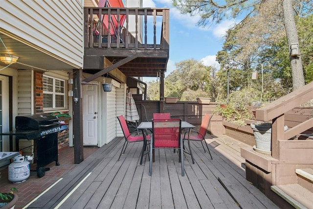 wooden terrace with area for grilling