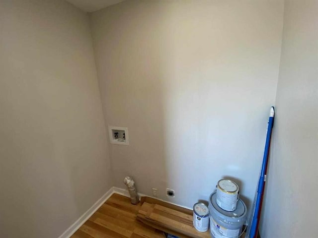 washroom with hookup for a washing machine, electric dryer hookup, and wood-type flooring