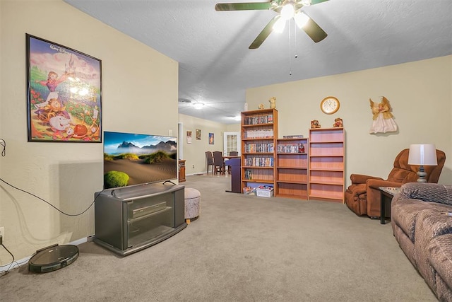 carpeted living room with ceiling fan