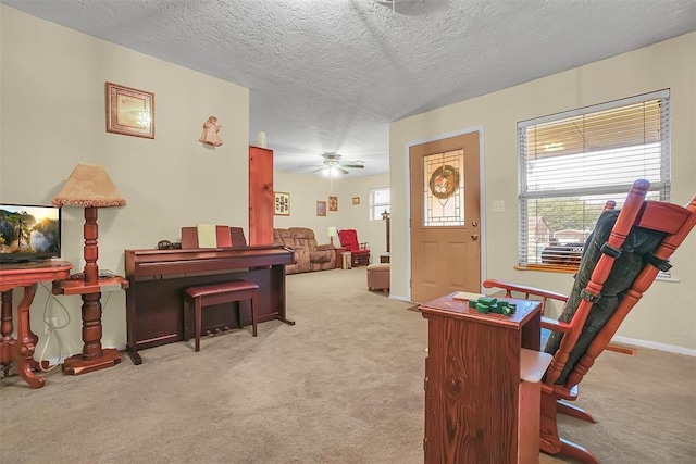 1304 N Market St, Cordell, OK 73632 - sitting room featuring carpet flooring, healthy amount of natural light, a textured ceiling, and a ceiling fan