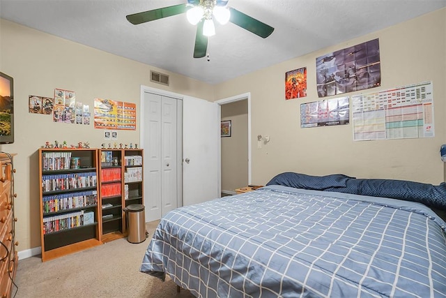 bedroom featuring carpet, a closet, and ceiling fan