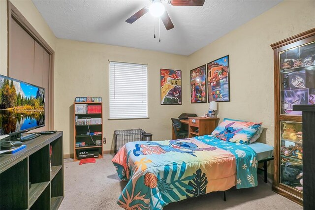 1304 N Market St, Cordell, OK 73632 - carpeted bedroom featuring a ceiling fan