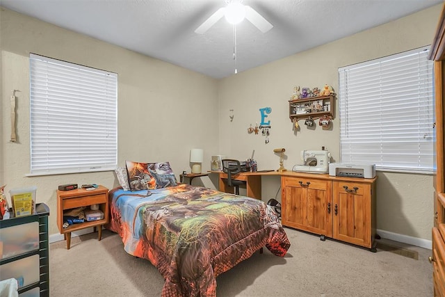 bedroom with light colored carpet and ceiling fan