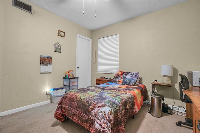 bedroom featuring light colored carpet