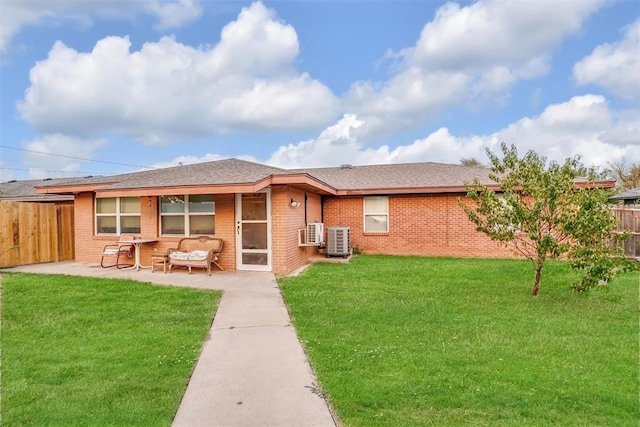 back of property featuring a yard and a patio area