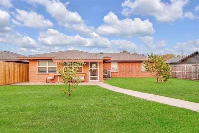 1304 N Market St, Cordell, OK 73632 - back of house with brick siding and a patio