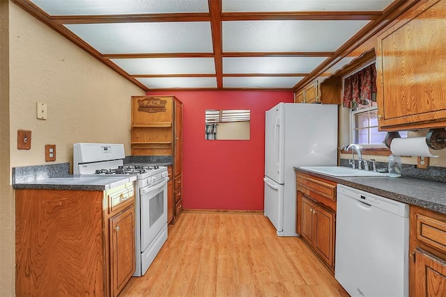 kitchen featuring light hardwood / wood-style flooring, white appliances, and sink