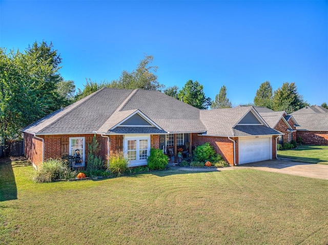 single story home with a front yard and a garage