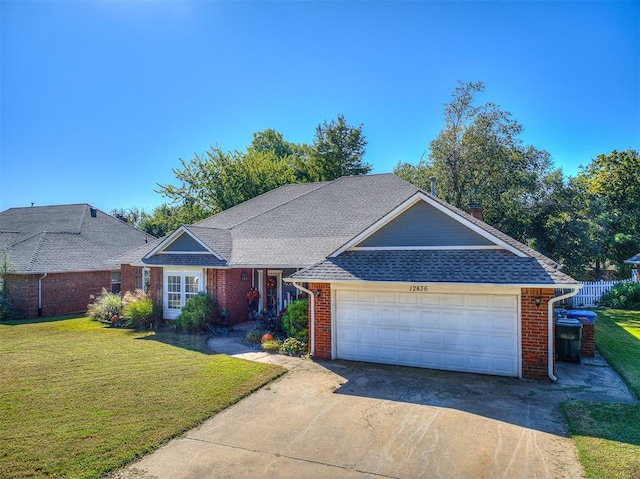 ranch-style home featuring a front yard and a garage