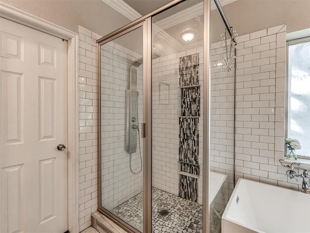 bathroom with plus walk in shower, crown molding, and sink