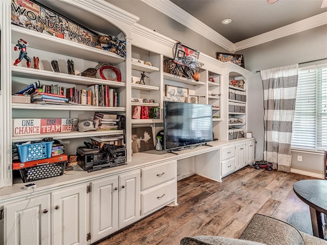 home office featuring hardwood / wood-style floors and crown molding