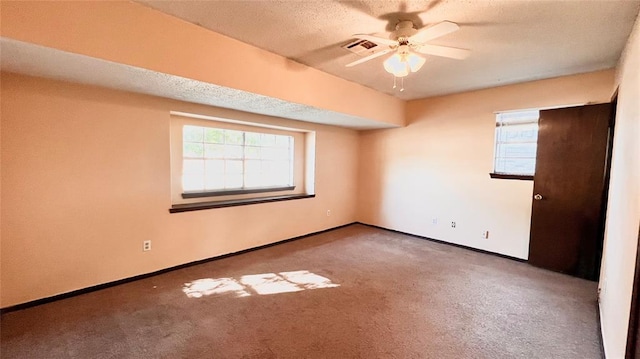 unfurnished room with carpet, a textured ceiling, and ceiling fan