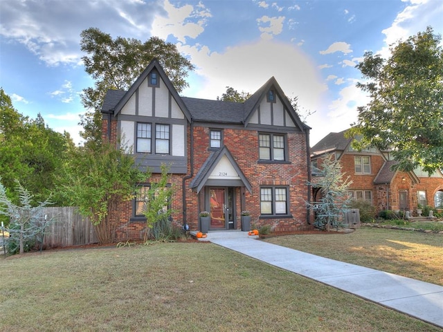 tudor house featuring a front yard