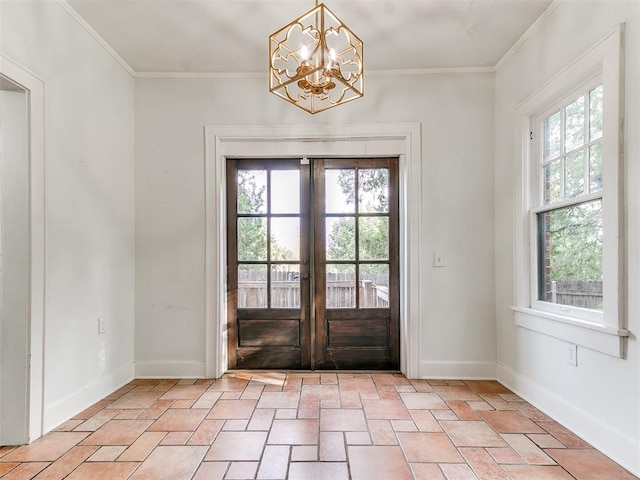 entryway with french doors, an inviting chandelier, and ornamental molding