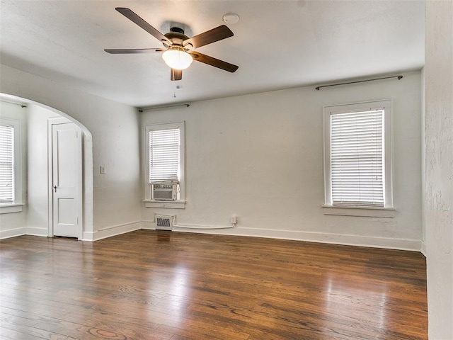 unfurnished room featuring ceiling fan, cooling unit, and dark wood-type flooring