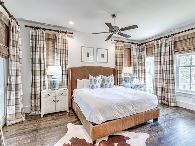 bedroom featuring dark hardwood / wood-style floors and ceiling fan