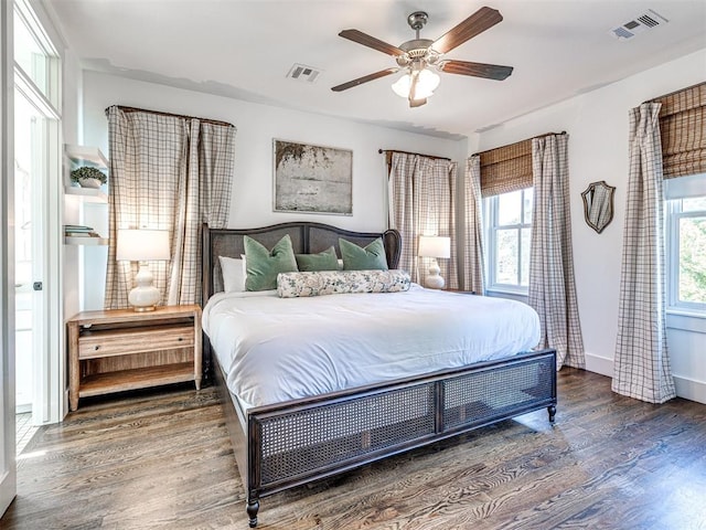 bedroom with hardwood / wood-style floors and ceiling fan