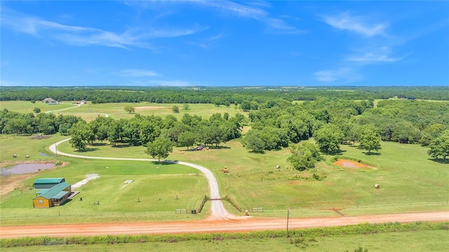 birds eye view of property with a rural view