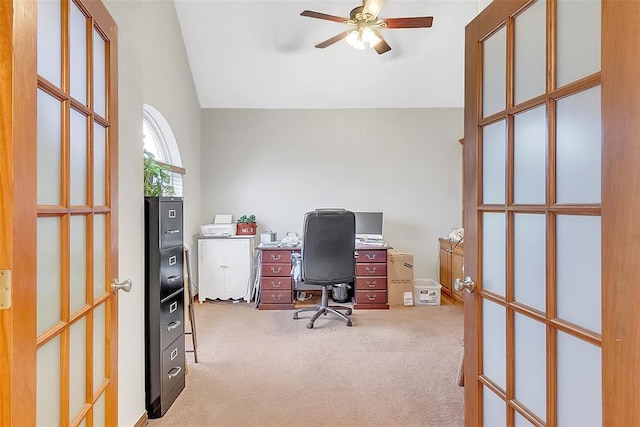 carpeted office space with ceiling fan and lofted ceiling