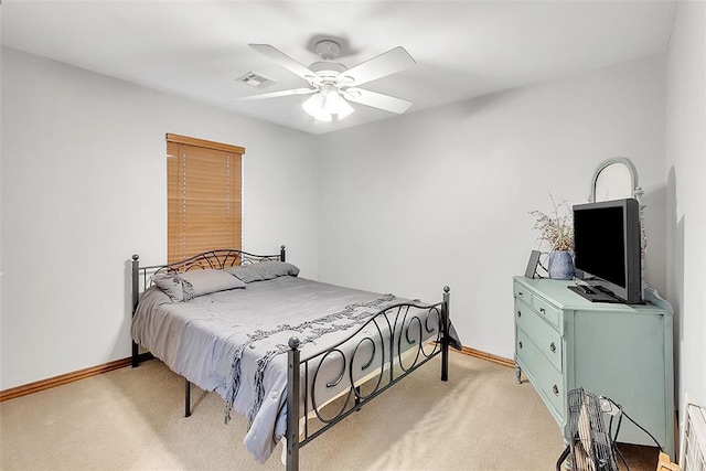 bedroom featuring ceiling fan and light colored carpet